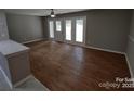 Spacious living area with hardwood floors and access to a patio at 6106 Meadow Rose Ln, Charlotte, NC 28215