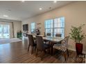 Casual dining area with wood floors and a view to the living room at 6525 Gopher Rd, Indian Land, SC 29707