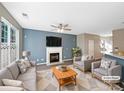 Virtually staged living room featuring fireplace and ample seating at 908 Coffee Tree Ln, Rock Hill, SC 29732