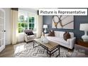 Bright living room with large windows and comfy seating at 1002 Merganser Way, Indian Trail, NC 28079