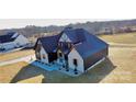 Stunning aerial view of a modern farmhouse at 1008 Harrogate Dr, Bessemer City, NC 28016