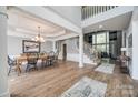 Elegant dining room with coffered ceilings, hardwood floors, and plenty of natural light at 11006 Knight Castle Dr, Charlotte, NC 28277