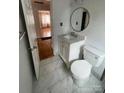 Bright bathroom featuring marble tile floor and modern fixtures at 1217 Spruce St, Charlotte, NC 28203