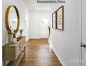 Bright entryway with hardwood floors, a large mirror, and art pieces at 1354 37Th Avenue Ne Ln, Hickory, NC 28601