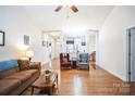 Spacious living room with hardwood floors, fireplace, and vaulted ceiling at 2019 Stoney Point Cir, Monroe, NC 28112