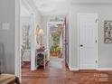Bright and airy entryway with hardwood floors and console table at 2717 New Hamlin Way, Charlotte, NC 28210