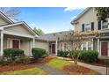 Attractive exterior of townhome with landscaping and walkway at 2717 New Hamlin Way, Charlotte, NC 28210