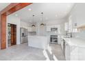 Modern white kitchen with stainless steel appliances and island at 414 W Harvie Ave, Gastonia, NC 28052