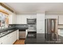 Kitchen with granite countertops and stainless steel appliances at 4630 Dawnwood Dr, Charlotte, NC 28212