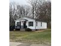 Quaint single-story house displaying crisp white siding, black trim, and a cozy front porch at 629 S Caldwell St, Salisbury, NC 28144