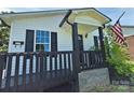 Close up view of cozy front porch, American flag and black trim at 629 S Caldwell St, Salisbury, NC 28144