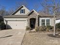 Beautiful home featuring stone accents, a two-car garage, and a well-manicured front yard at 7522 Porrera St, Charlotte, NC 28214