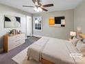 Virtually staged bedroom with ceiling fan and neutral decor at 1005 Woodland Dr, Gastonia, NC 28054