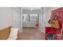 Bright and spacious entryway with wooden bench and red coat rack at 1361 Colwick Ln, Rock Hill, SC 29732