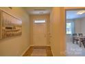 Welcoming entryway with a light-filled foyer, wood-look floors, and a decorative rug at 1381 6Th Ne St, Hickory, NC 28601