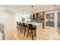 Modern kitchen with an island and four barstools at 531 Manhasset Rd, Charlotte, NC 28209