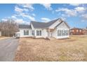 Ranch style home with a gray roof and green shutters at 6328 W Nc 10 Hwy, Hickory, NC 28602
