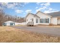 View of the home's side entrance and detached garage at 6328 W Nc 10 Hwy, Hickory, NC 28602