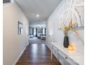 Bright entryway with hardwood floors and view into living room at 9353 Creedmore Hills Dr, Charlotte, NC 28214