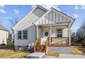 Newly built Craftsman style home with gray siding and brick steps at 109 E Broad St, Salisbury, NC 28144