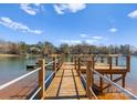 Private boat dock boasts ample space for relaxation and stunning waterfront views at 125 Chestnut Tree Rd, Mooresville, NC 28117