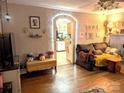 Living room with hardwood floors, fireplace and view into kitchen at 160 Brookwood Ne Ave, Concord, NC 28025