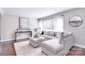 Bright and airy living room featuring modern decor, a plush rug, and ample seating at 1721 Edgewater Dr, Charlotte, NC 28210