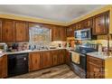 Classic kitchen featuring wood cabinets and stainless steel appliances at 1968 12Th Street Ne Pl, Hickory, NC 28601