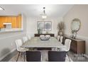 Spacious dining area with large concrete table and modern chairs at 19773 Deer Valley Dr, Cornelius, NC 28031