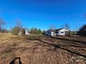 White house with detached building and yard at 211 Forgotten Ln, Bessemer City, NC 28016