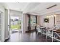 Bright dining room featuring a rustic wood table and white chairs at 2178 Grist Mill Dr, Concord, NC 28025