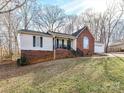 A charming ranch-style home with a brick foundation, siding, and an attached garage at 3605 Truxton Ct, Waxhaw, NC 28173