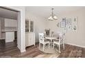 Charming dining room with white table and chairs, and hardwood floors at 50005 Guy Ln, Norwood, NC 28128