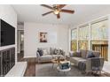 Spacious living room featuring wood floors and large windows at 50005 Guy Ln, Norwood, NC 28128