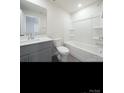 Bathroom with gray vanity, toilet and bathtub with shower at 800 Parkette St, Concord, NC 28027