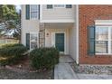 Front entrance with green door and stone accents at 8018 Trotter Rd, Charlotte, NC 28216