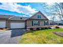 Beige house with attached garage and neatly landscaped front yard at 823 Wynnshire Dr # C, Hickory, NC 28601