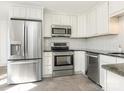 Stainless steel appliances and granite countertops in this updated kitchen at 8406 Tifton Rd, Charlotte, NC 28226