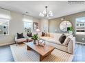 Living room with beige sofa, coffee table, and two armchairs at 9862 Old Garden Cir, Gastonia, NC 28056