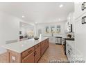 Bright kitchen featuring a large island with bar seating and stainless steel appliances at 12009 Garmon Mill Estates Dr # 2P, Stanfield, NC 28163