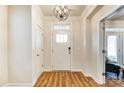 Bright entryway with hardwood floors and chandelier at 13328 Caite Ridge Rd, Davidson, NC 28036