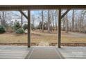A view of the front yard from the covered porch at 4530 Meandering Way, Conover, NC 28613