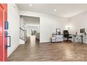 Bright entryway with hardwood floors, leading to living area and stairs at 6270 Durango Way, Denver, NC 28037