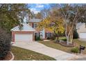 Traditional two-story brick home with an inviting entrance and well-maintained landscaping at 10015 Lattice Ct, Charlotte, NC 28269