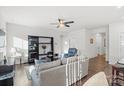 Spacious living room with hardwood floors and a cozy seating area at 10356 Black Locust Ln, Harrisburg, NC 28215