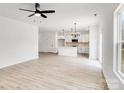 Open living area with hardwood floors and a view into the kitchen at 1510 Nectar Way, Kannapolis, NC 28027