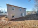 Rear view of a two-story house with gray siding and multiple windows at 162 Four Andrews Dr, Harmony, NC 28634