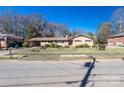 Inviting ranch home with a covered carport and manicured front yard at 202 Cedar St, Belmont, NC 28012