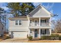 Two-story house with gray siding, a two-car garage, and a front porch at 232 Morgans Branch Rd, Belmont, NC 28012