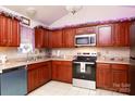 Well-equipped kitchen with wood cabinets and stainless steel appliances at 234 Henson Ln, McConnells, SC 29726